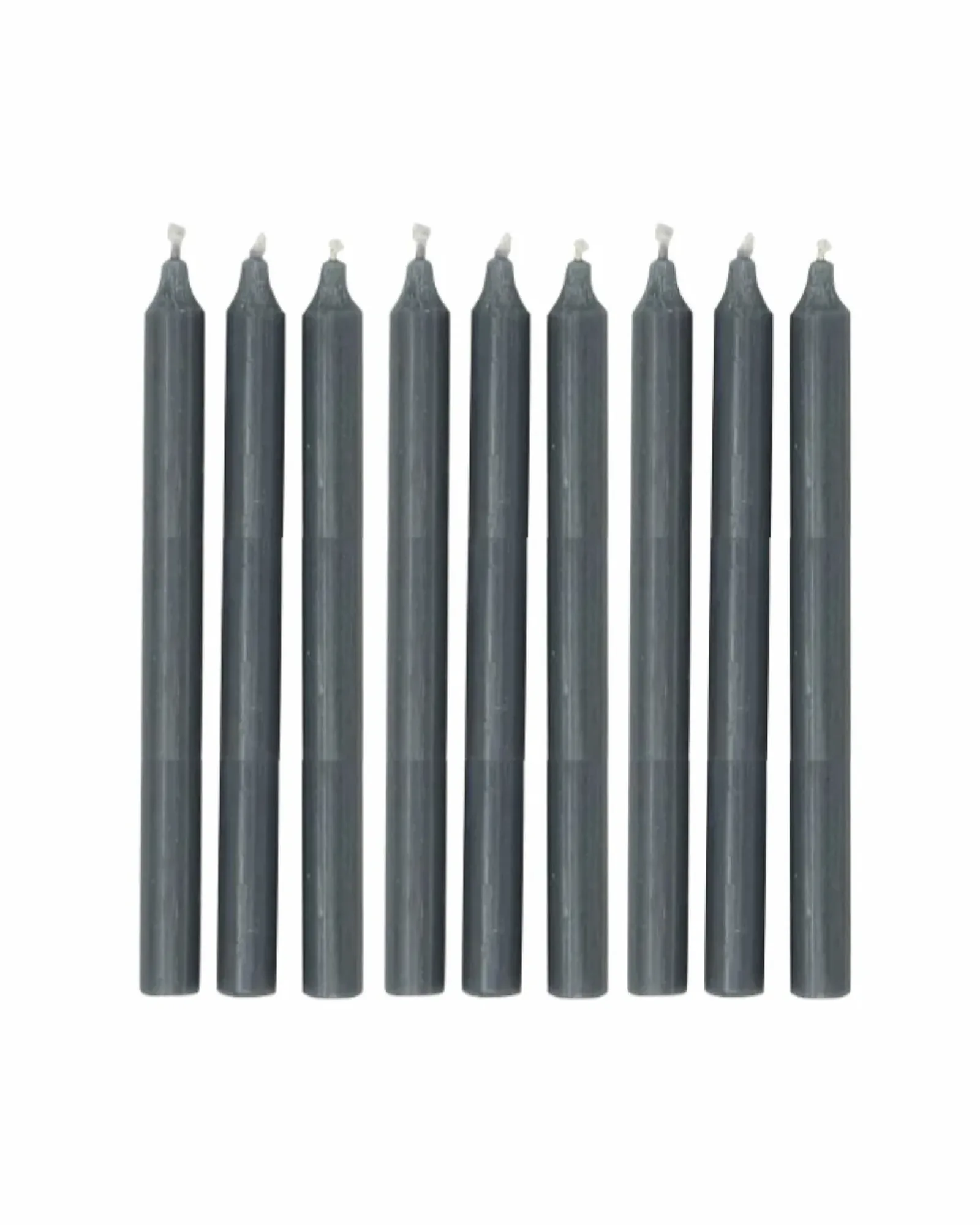 A single dark grey dinner candle standing upright, photographed against a plain background.