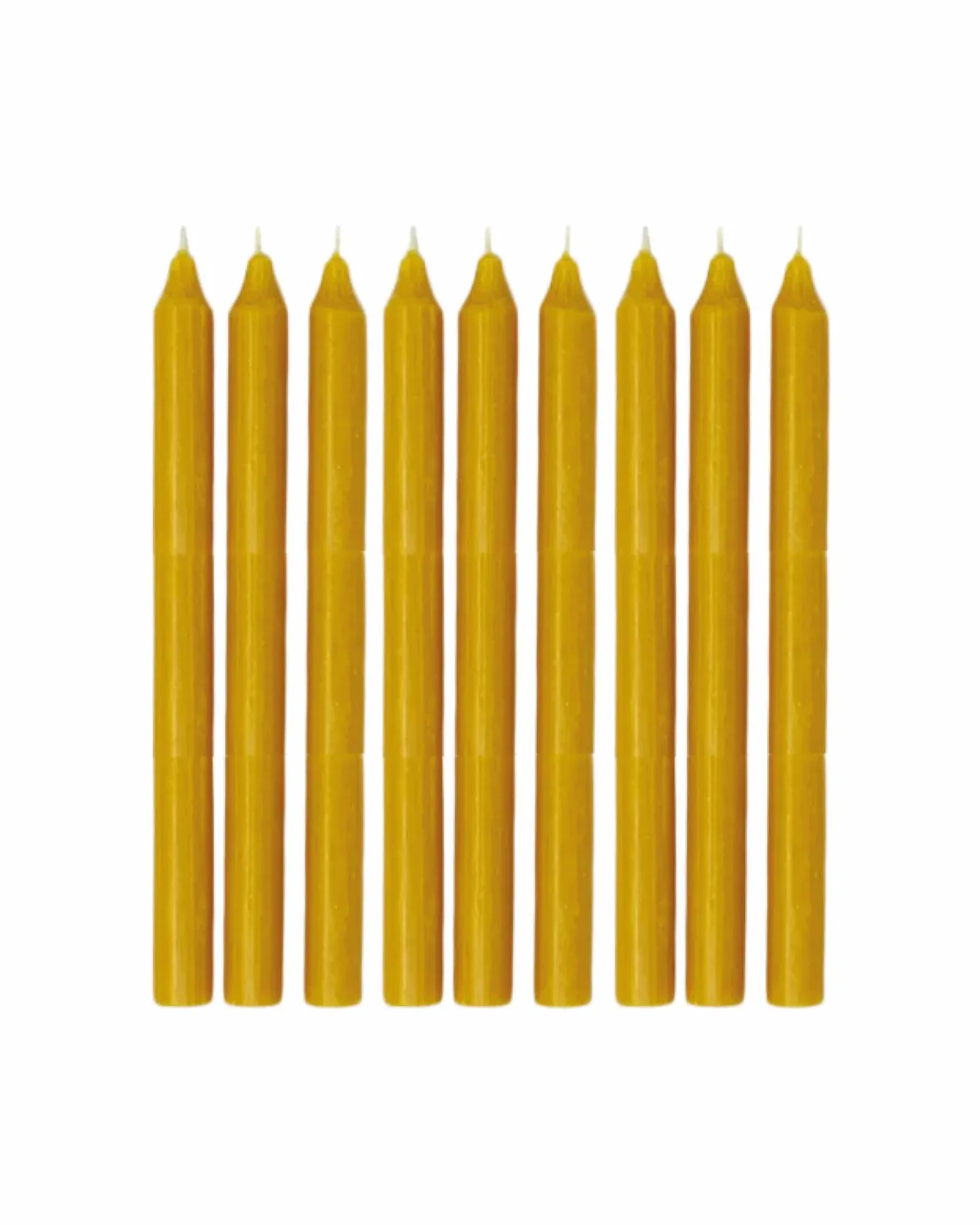 A single honey dinner candle standing upright, photographed against a plain background.